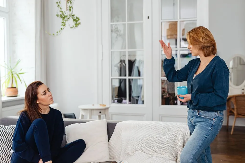 Two people chatting at home